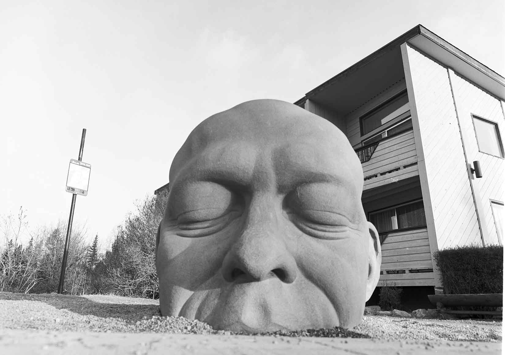 The Big Head statue downtown Canmore. Photo by Damian Lamartine