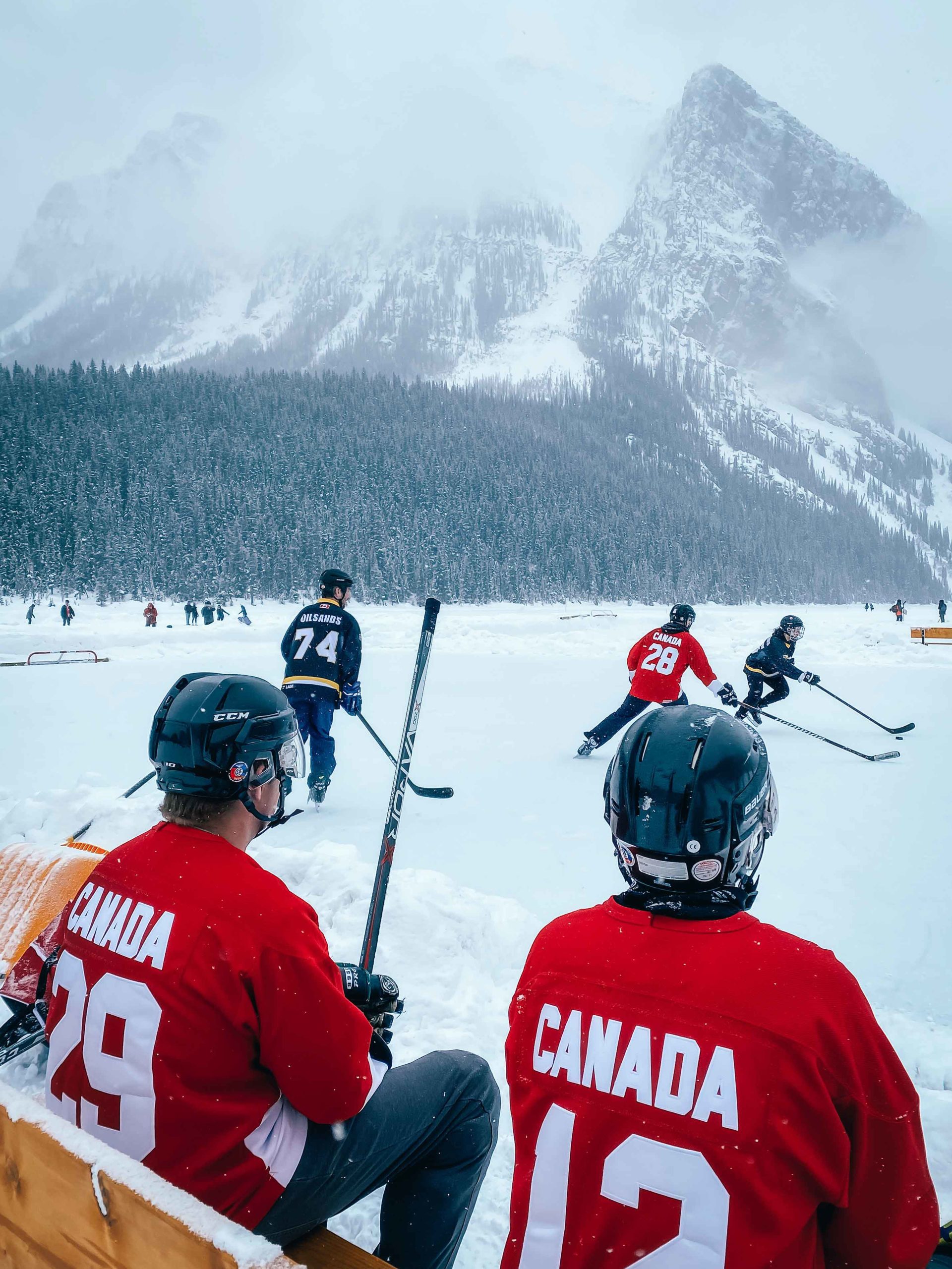 Using a foreground, like the hockey players in this photo, is one of the great photography tips for your phone by Sanjay Chauhan 