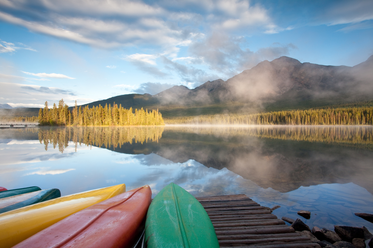 Colourful canoes line the dock at Pyramid Lake in Jasper, a precursor to the perfect day on the water