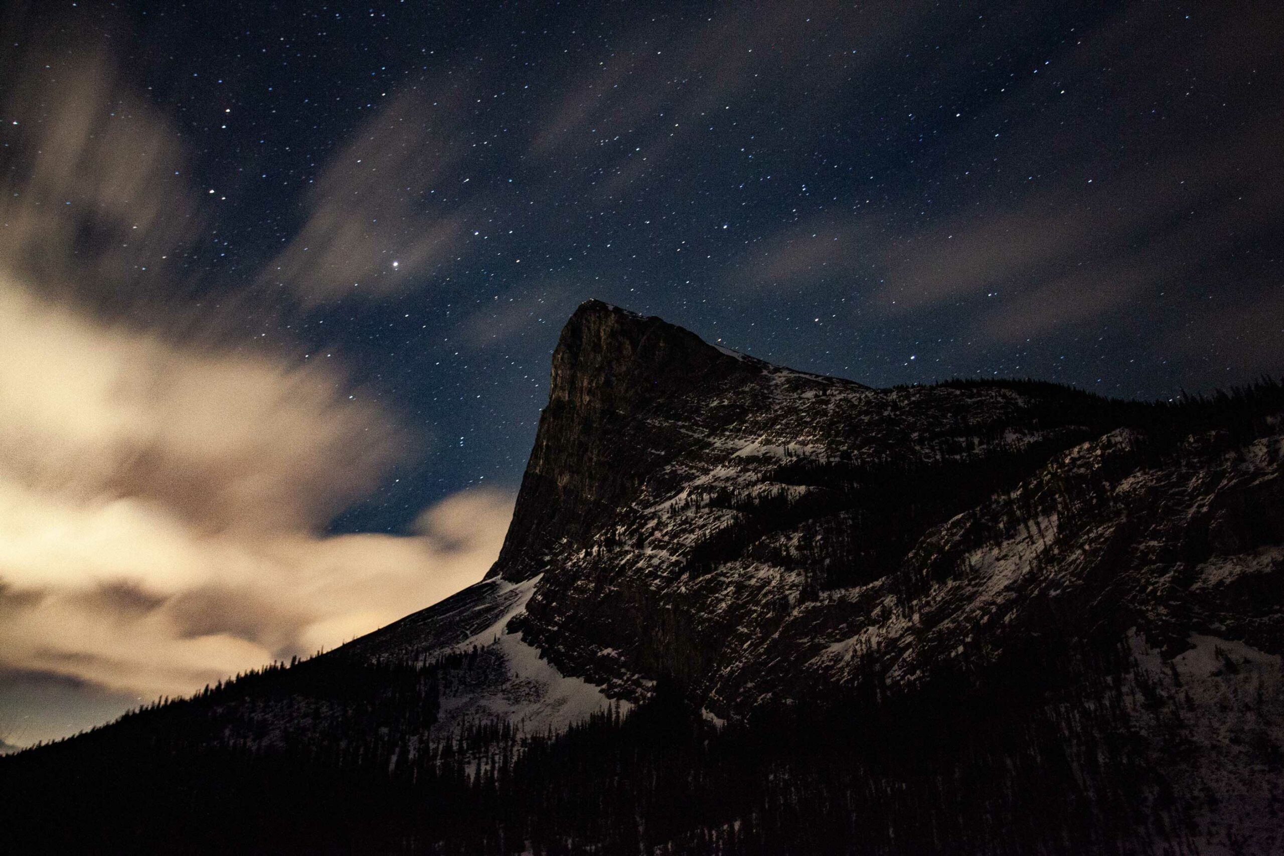 Lowlight photography of Ha Ling Peak in Canmore by Rory Carroll