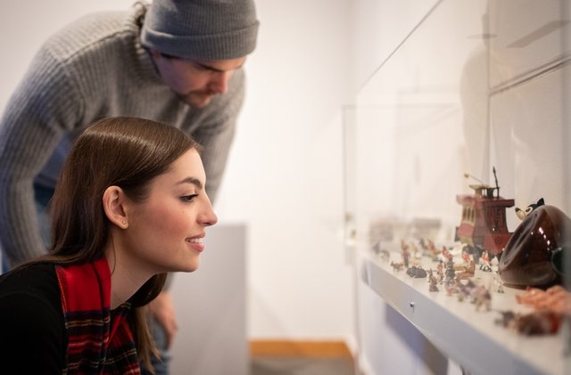 Two people look at an exhibit at the Whyte Museum