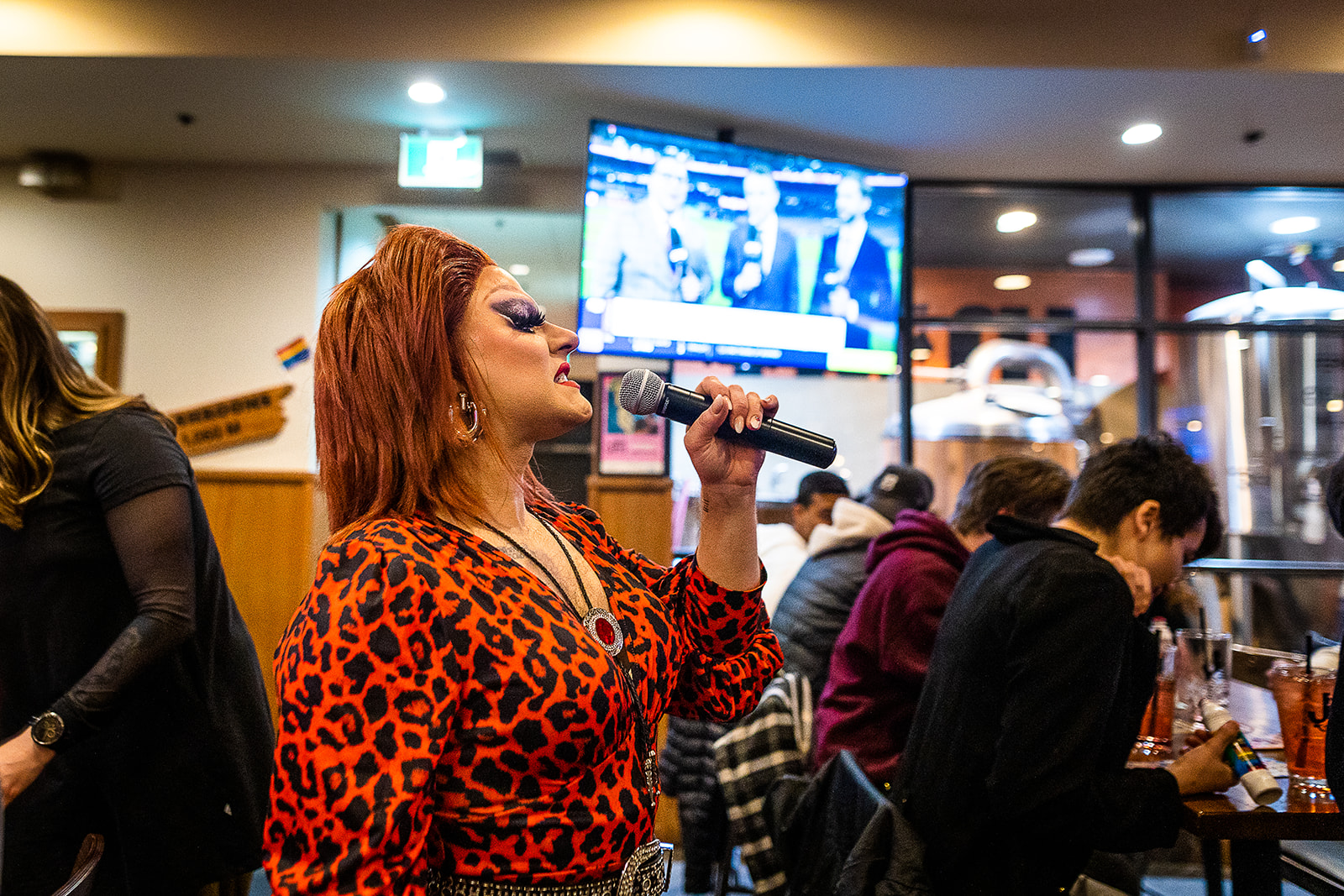 A drag queen on the microphone during Drag Bingo at Jasper Pride
