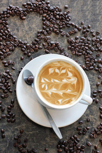Latte with a heart in coffee beans from The Old Grind