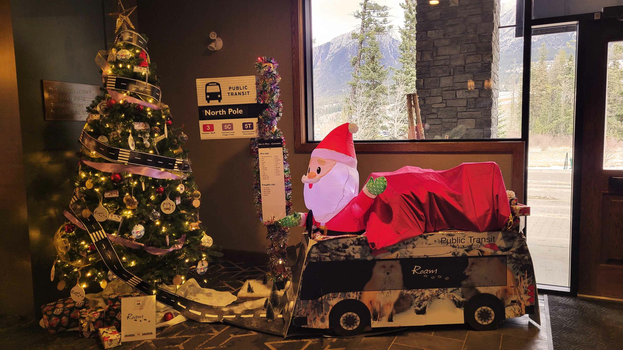 The festive tree from ROAM Transit features Santa Claus on a ROAM buss