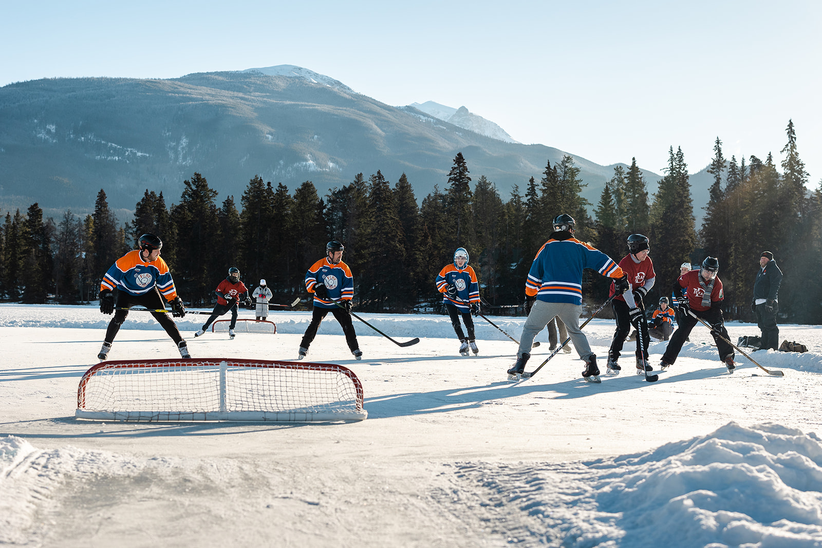 Hockey players compete at the Pond Hockey Tournament as part of the Jasper in January celebrations.