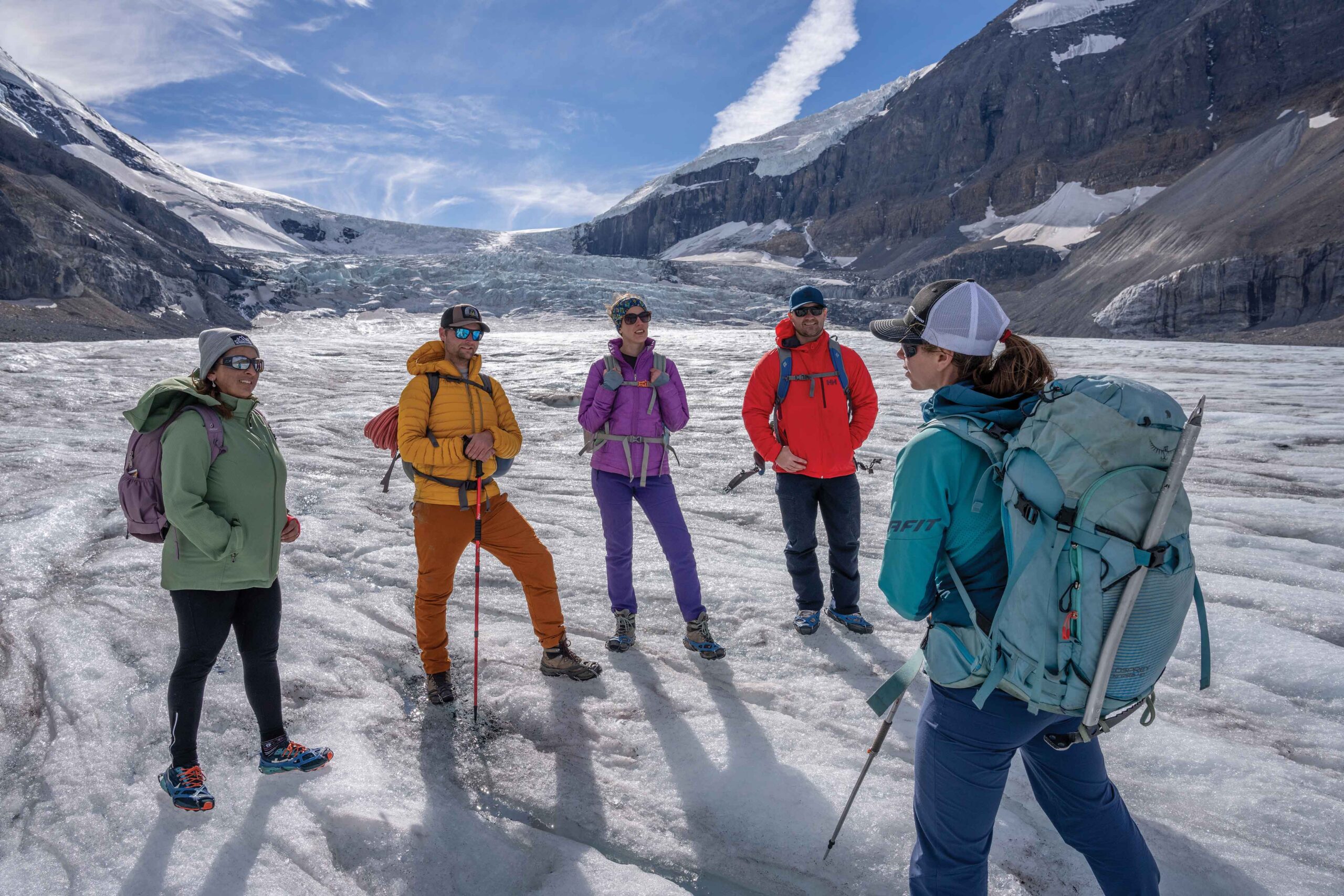 A group of people on a tour at the Athabasca Glacier