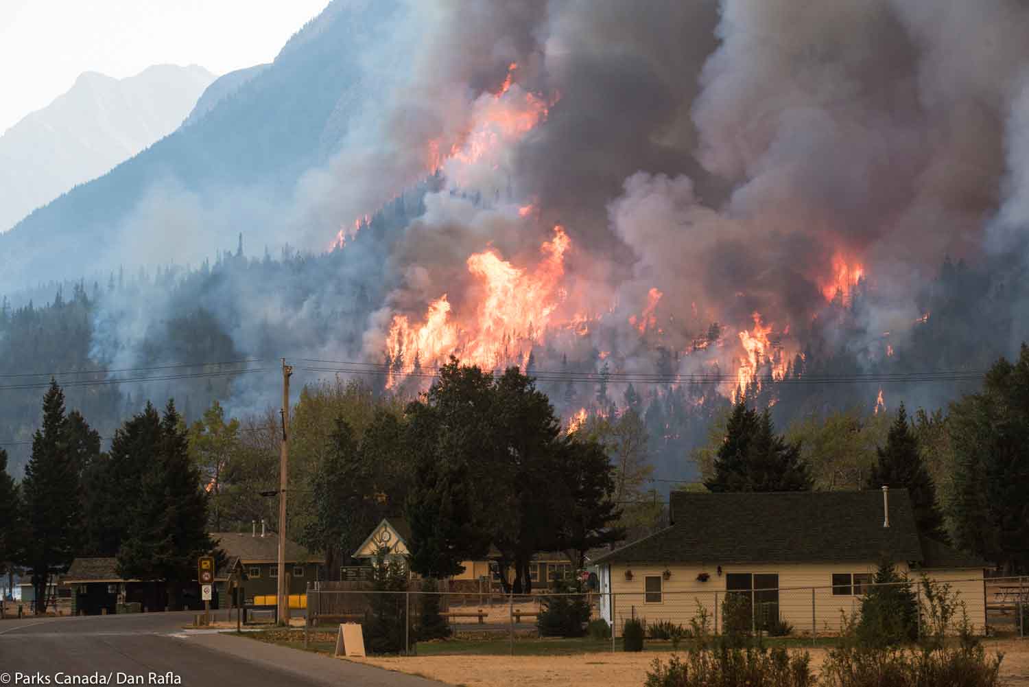 the Kenow Wildfire burns behind the townsite of Waterton.