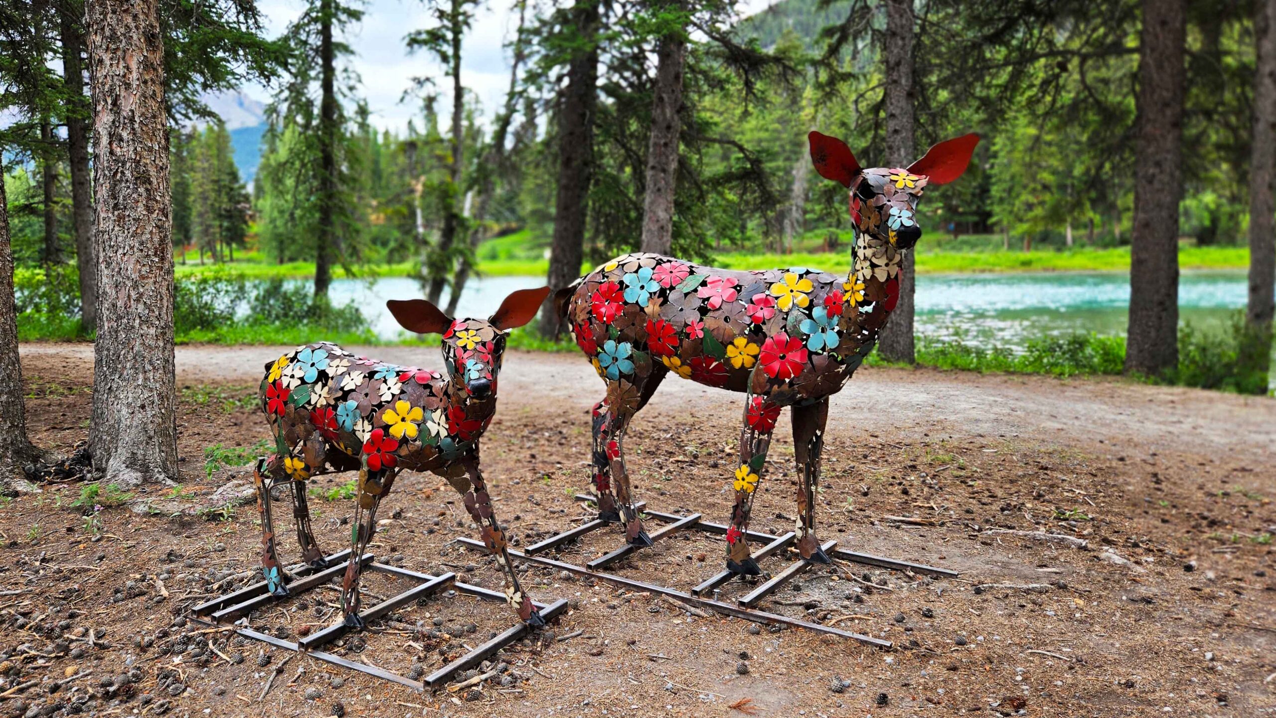 A doe and her fawn are created using colourful metal flowers from artist Cedar Mueller on the Art in Nature Trail in Banff