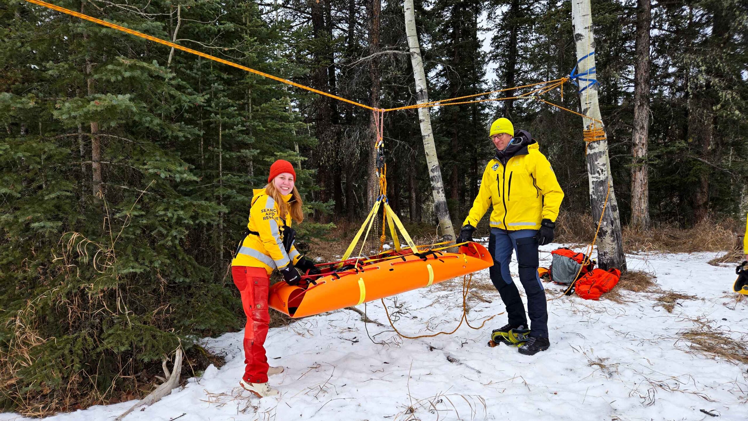 Members of Foothills Search and Rescue demonstrate rescue equipment at Winter Safety Day 2026