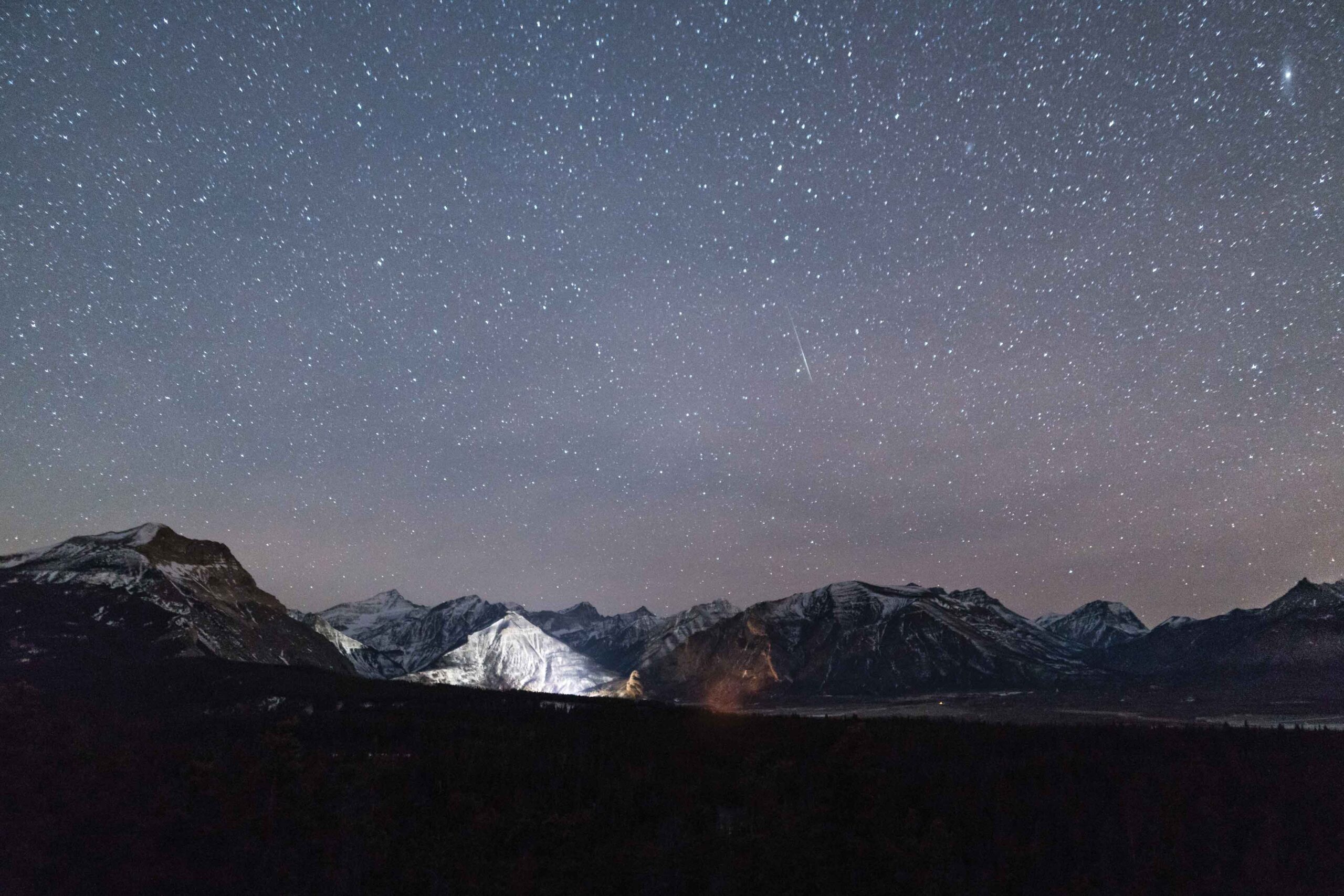 The dark shy shows shooting stars in Waterton Lakes National Park